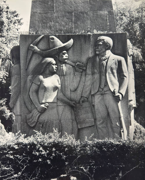 Land For The People: so far, Mexico is the Latin American country which has carried out the greatest land reform programs. Mexico's sweeping reforms are commemorated in the monument shown here, erected at Cuernavaca. The plaque reads: "Reform, Liberty, Justice and Law." By 1940 more than 14 million acres of cultivated land, out of a total of 30 million acres, had been distributed to landless farmers and their families, and further distributions have been put into effect since that time