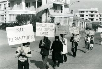 Greek Cypriots demonstrate on Friday, February 14, 1975 in response to Turkish declaration. They marched to Greek Presidential office where officials received them and remarked official support of their position, Turkey