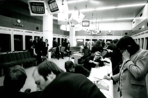 Room of stockbrokers on phone, London Stock Exchange, England