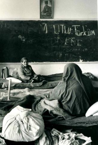 Turkish Cypriot State Declaration: Turkish refugees in Turkish school during eruptions following Feb. 13, 1975 declaration. They were shot at as they crossed the Greek sector of the city to reach the school. The older people were able to stay in campbeds most of the time, Cyprus, Turkey