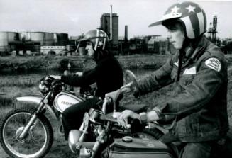 Two boys riding motorbikes, Manchester, England